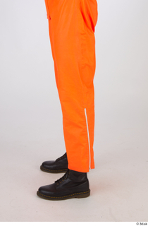 Shawn Jacobs Painter in Orange Covealls A Pose leg lower…